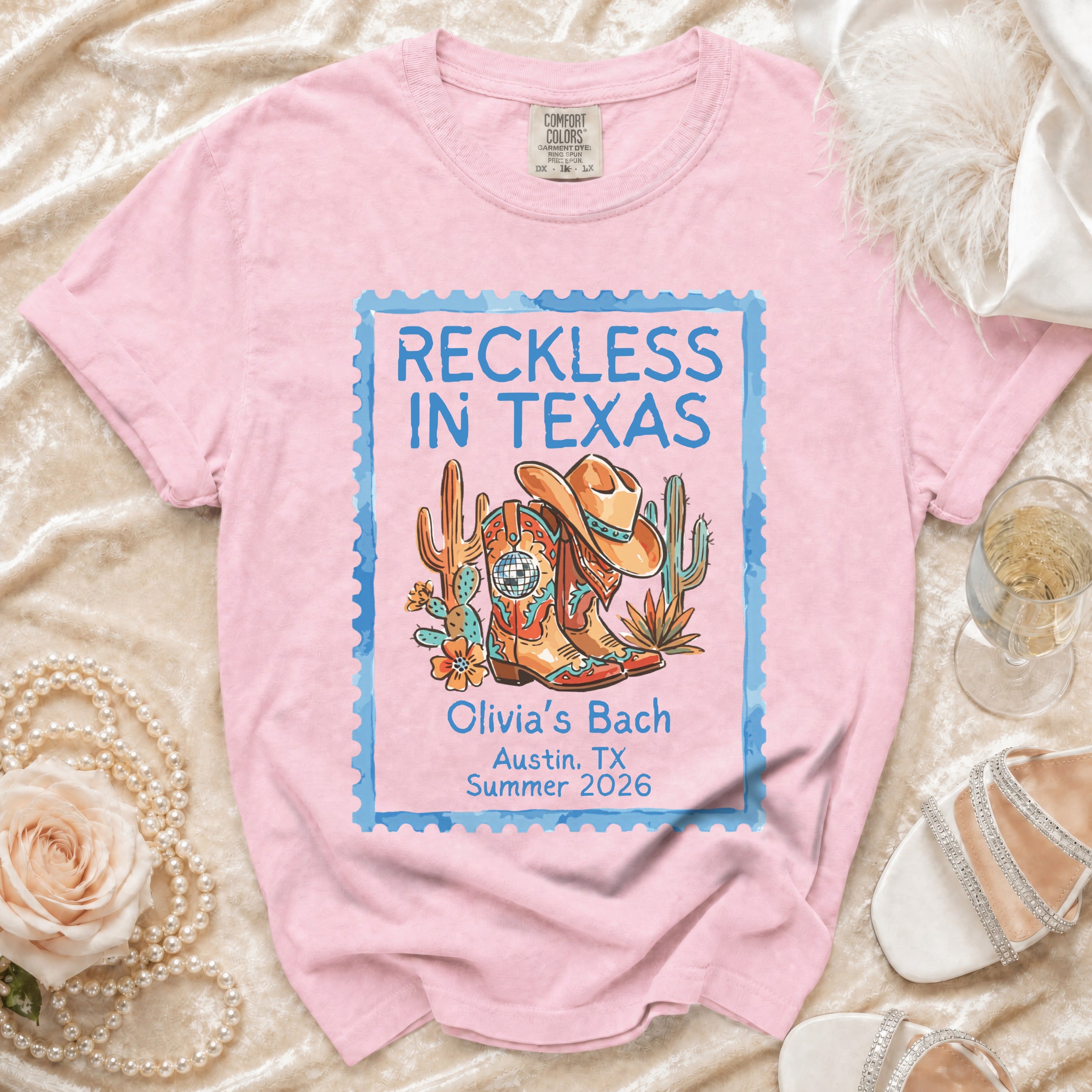 Pink t-shirt with "Reckless in Texas" and "Olivia's Bach Austin, TX Summer 2026" designs.