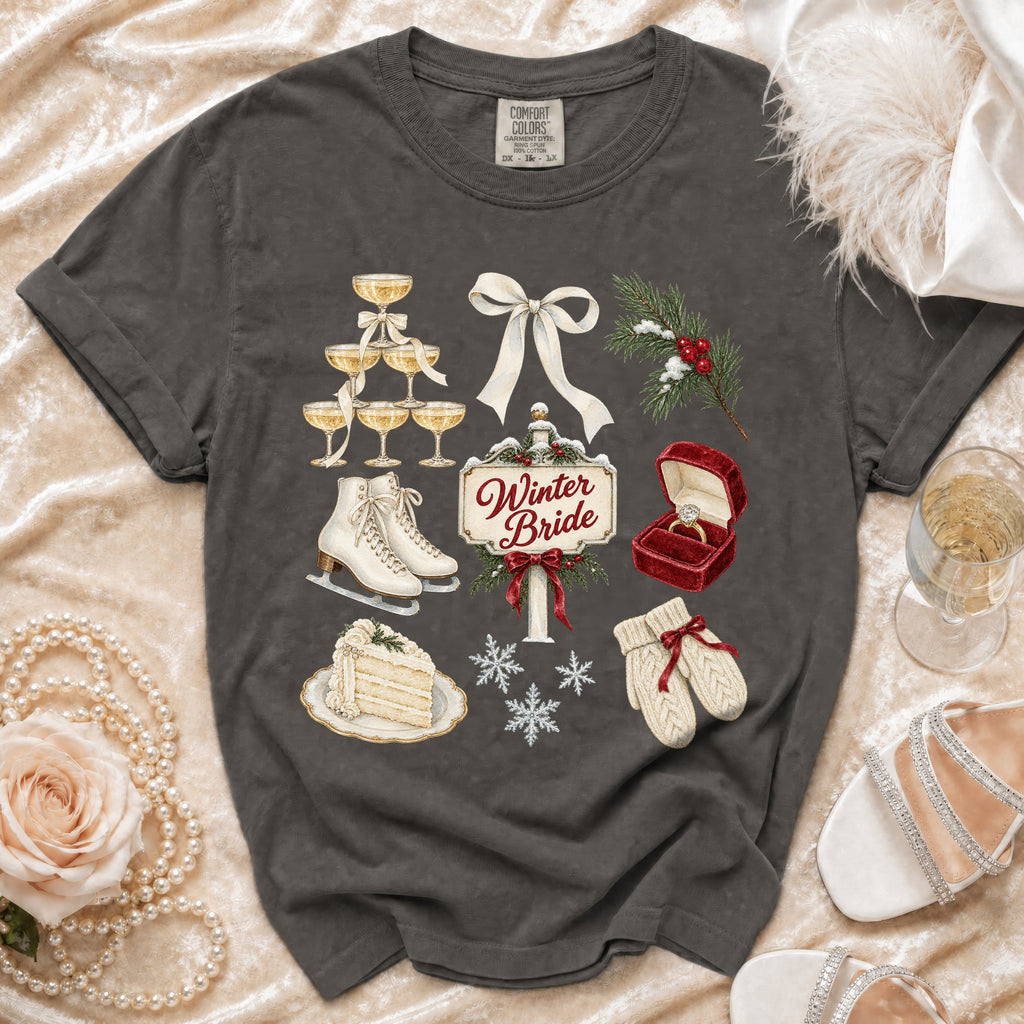 Graphic tee with winter wedding elements: champagne glasses, ring, cake, skates, mittens, snowflakes.