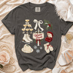 Graphic tee with winter wedding elements: champagne glasses, ring, cake, skates, mittens, snowflakes.