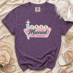Purple t-shirt with "Just Married Las Vegas" text on a retro sign.