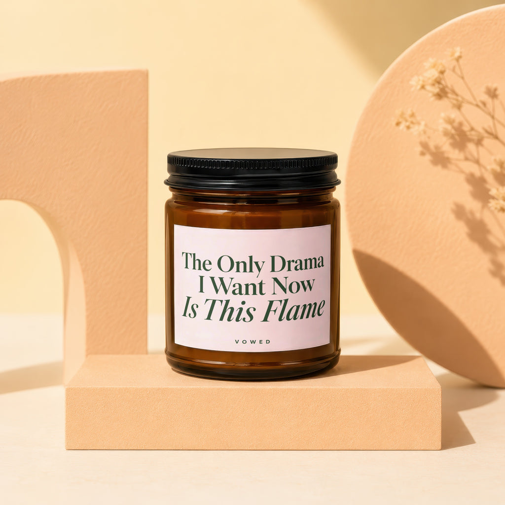 Brown candle in glass jar with black lid, label reads "The Only Drama I Want Now Is This Flame".