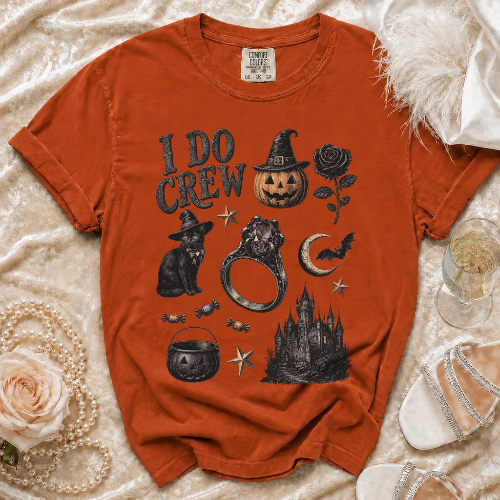 Orange t-shirt with "I DO CREW" and Halloween graphics: pumpkin, cat, castle, ring.