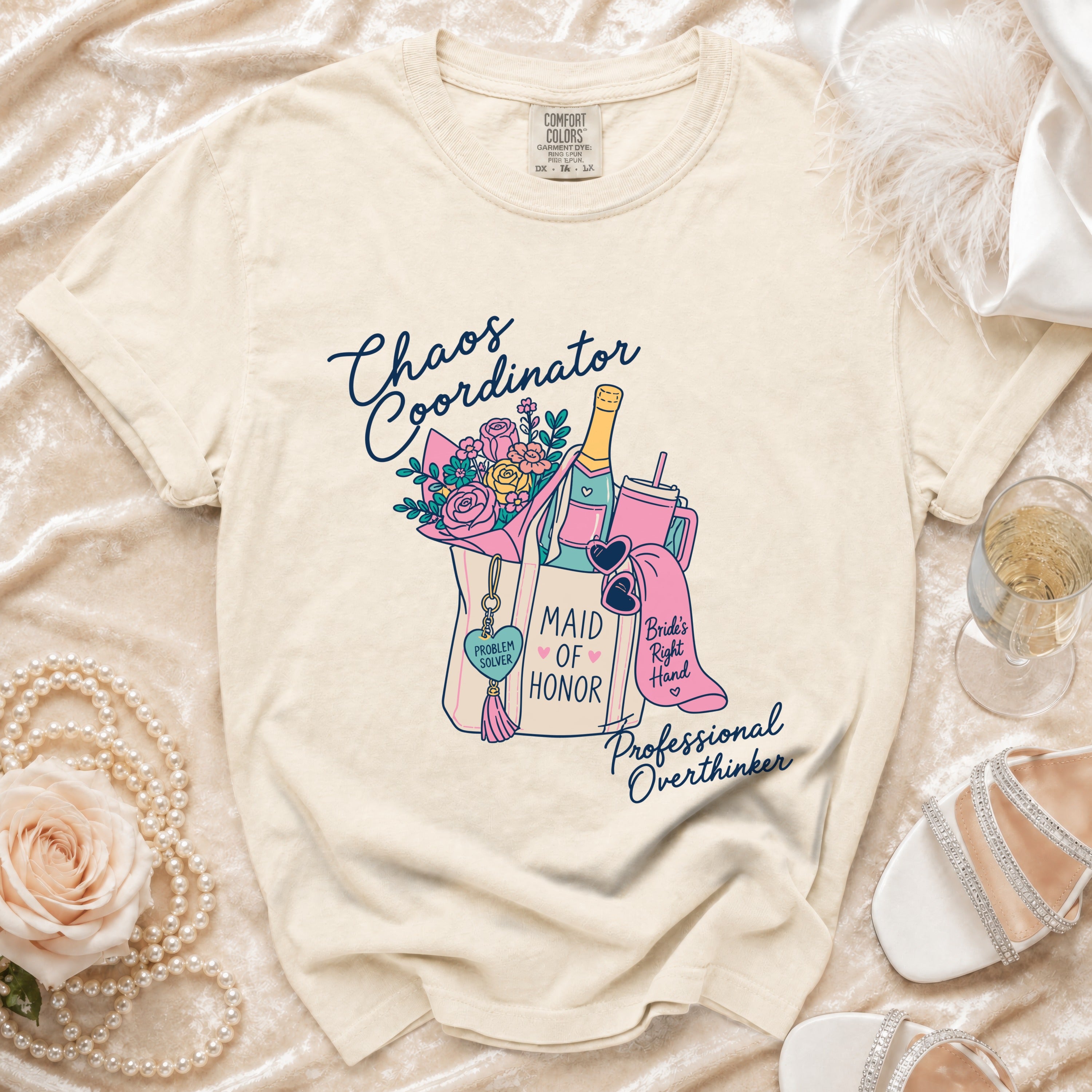 Cream t-shirt with "Chaos Coordinator" and "Maid of Honor" text design.