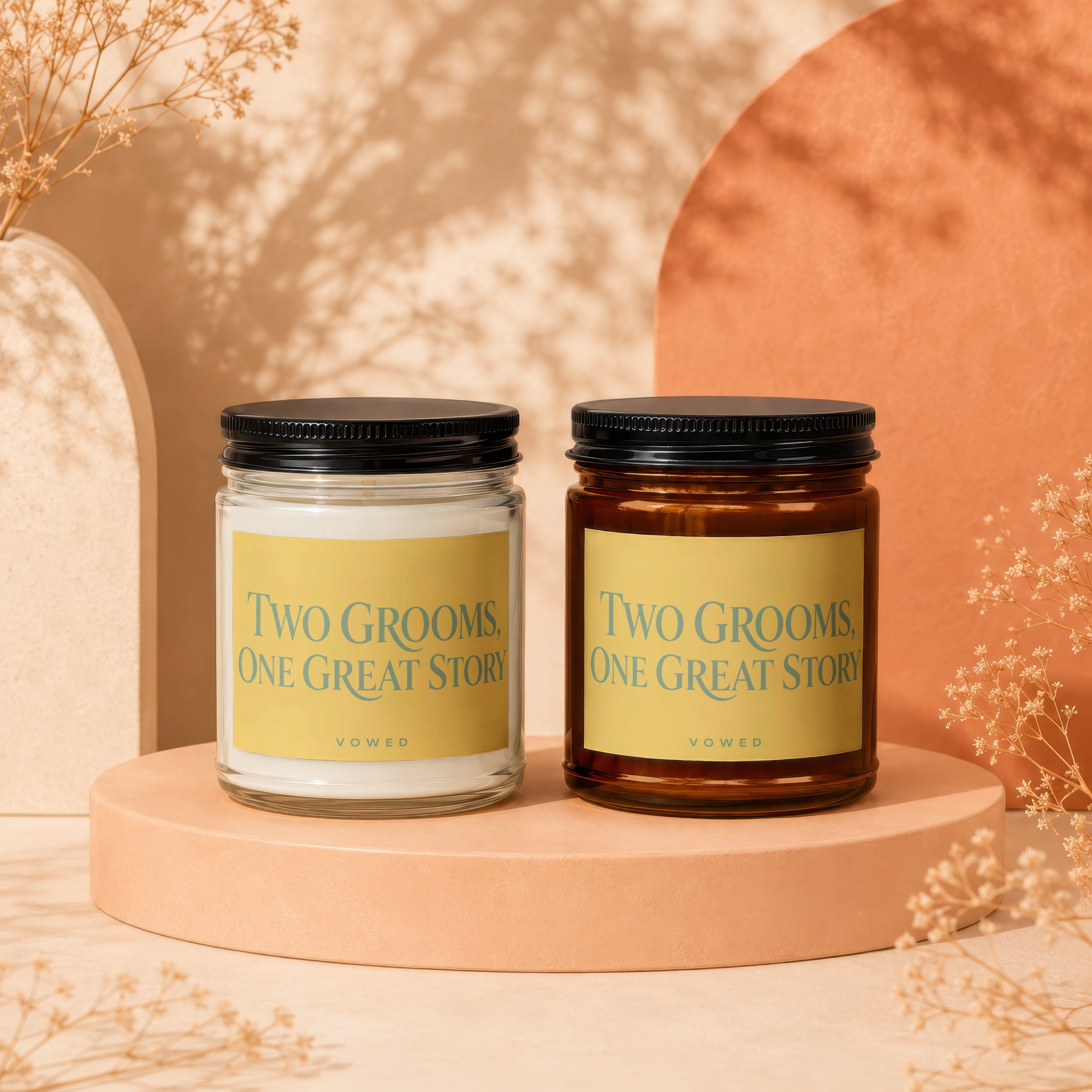 Two candles with yellow labels reading "Two Grooms, One Great Story" and "VOWED".