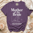 Purple Comfort Colors shirt with "Mother of the Bride" text and witch hat graphic.