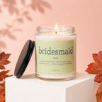 Glass candle labeled "bridesmaid" with its definition and the word "VOWED."
