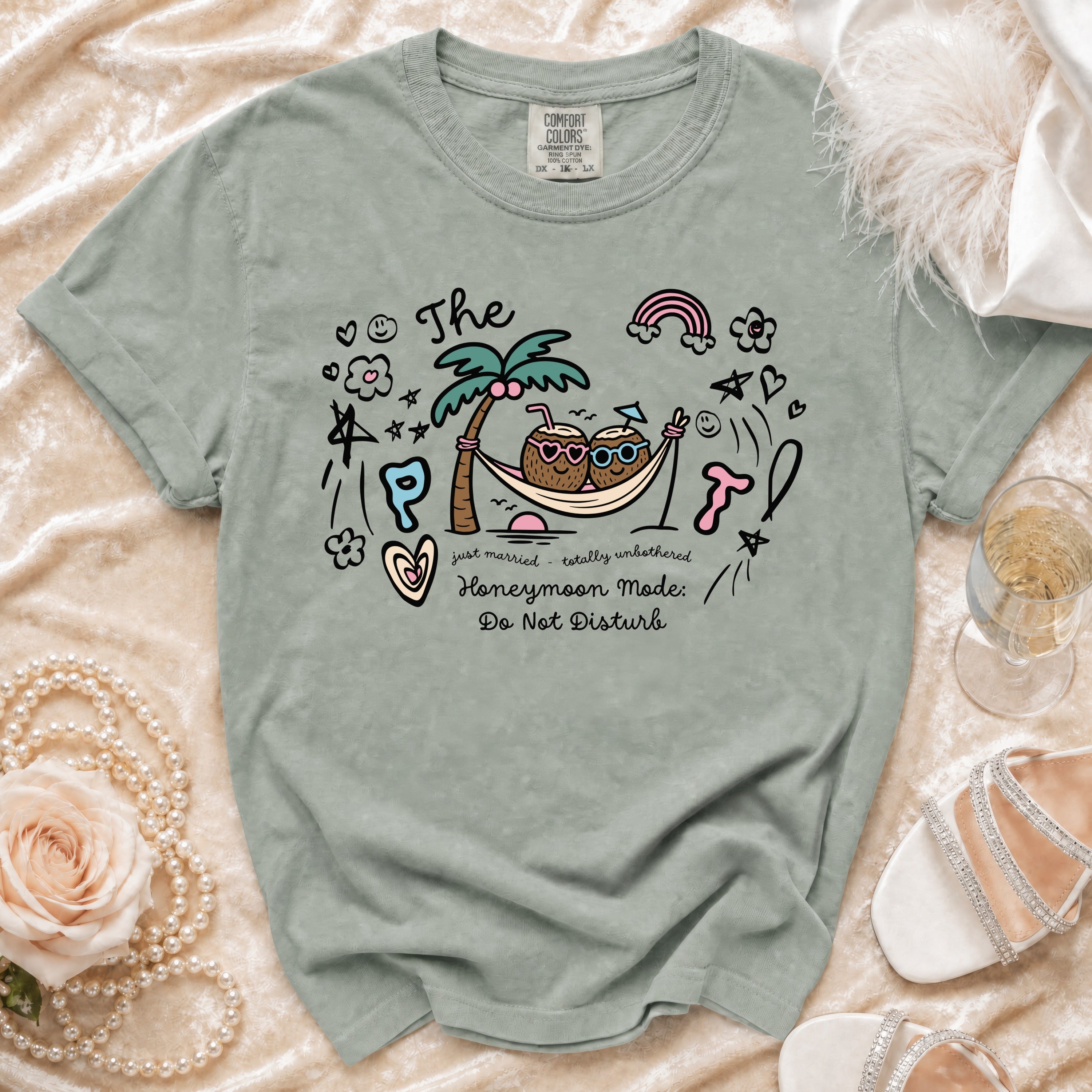 T-shirt with "The Honeymoon Mode: Do Not Disturb" text and cartoon coconuts.