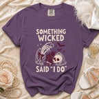 Purple t-shirt with "Something Wicked Said "I Do"" text and skeleton hand.