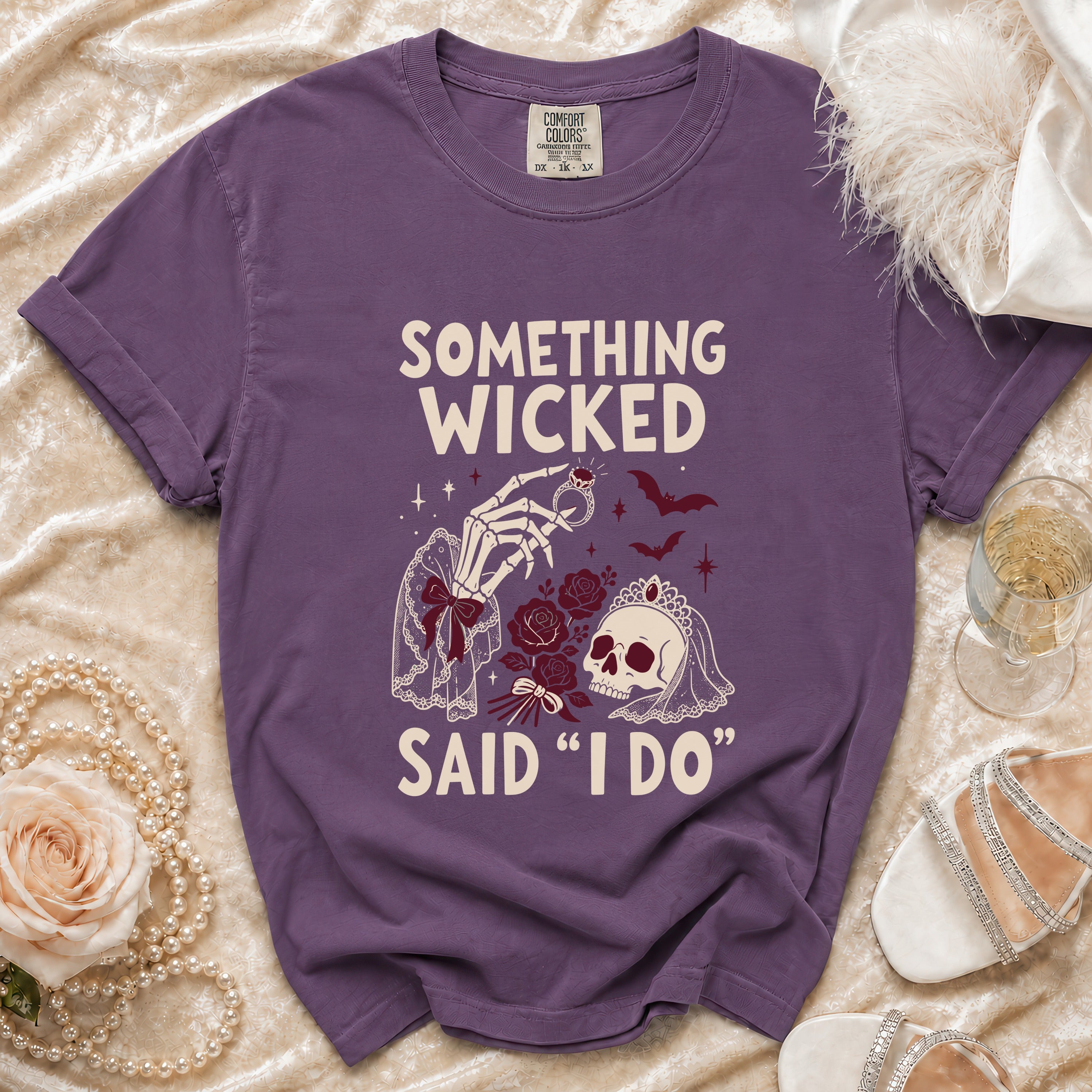 Purple t-shirt with "Something Wicked Said "I Do"" text and skeleton hand.