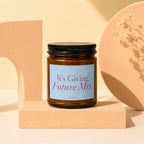 Amber candle with black lid and "It's Giving Future Mrs." label.