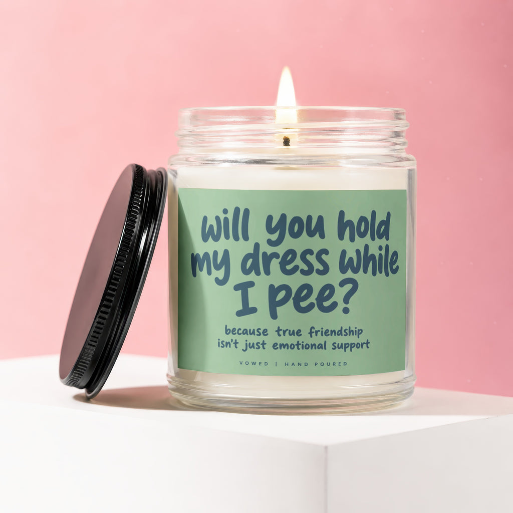 Candle with text "will you hold my dress while I pee?"