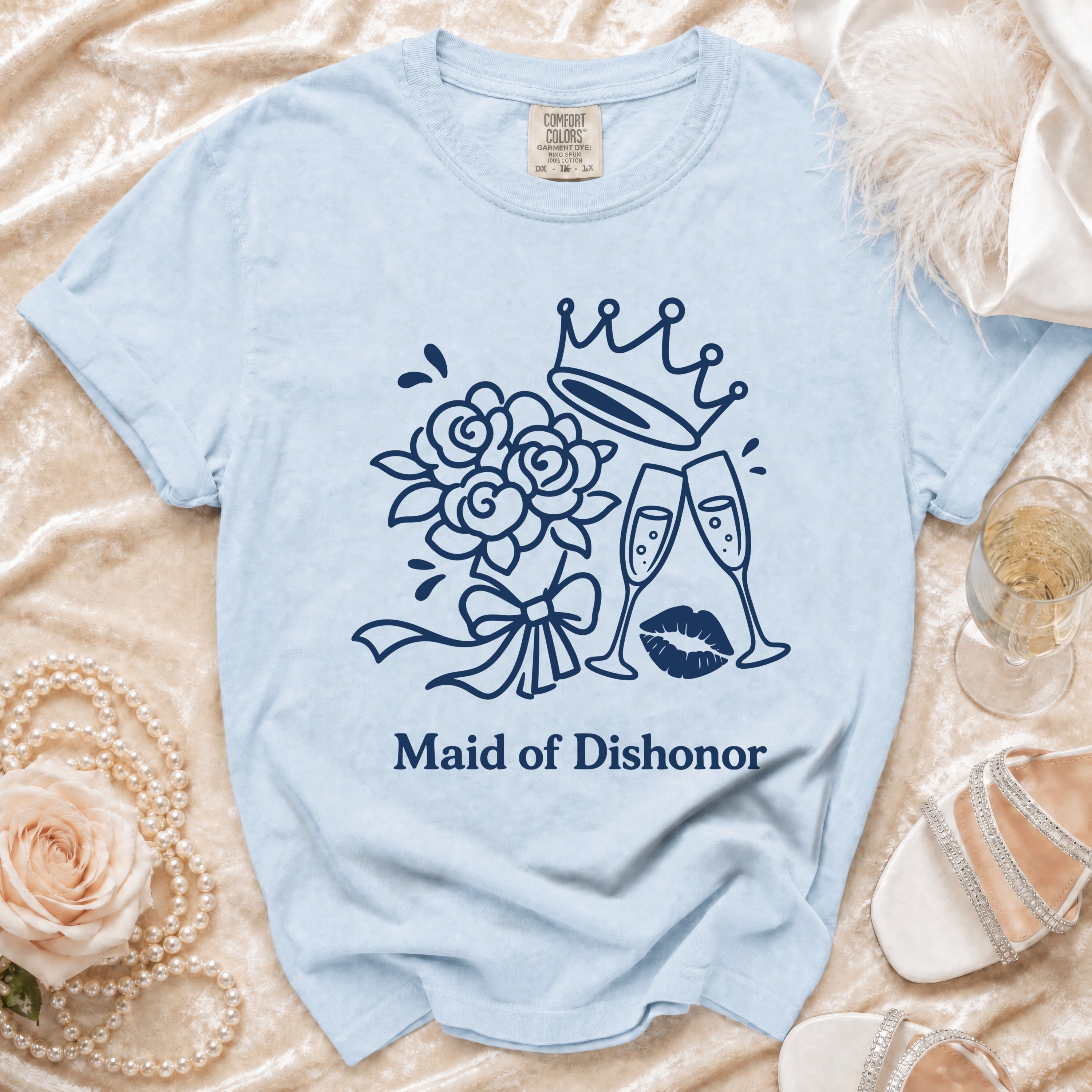 Light blue t-shirt with "Maid of Dishonor" text and crown, flowers, glasses, and lips graphic.