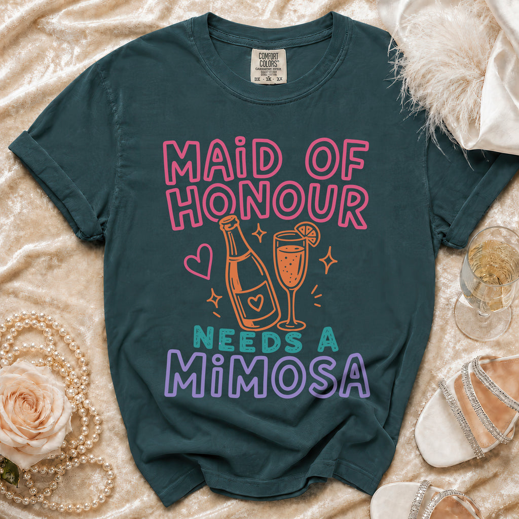 Maid of Honour Needs a Mimosa text on a dark green t-shirt.