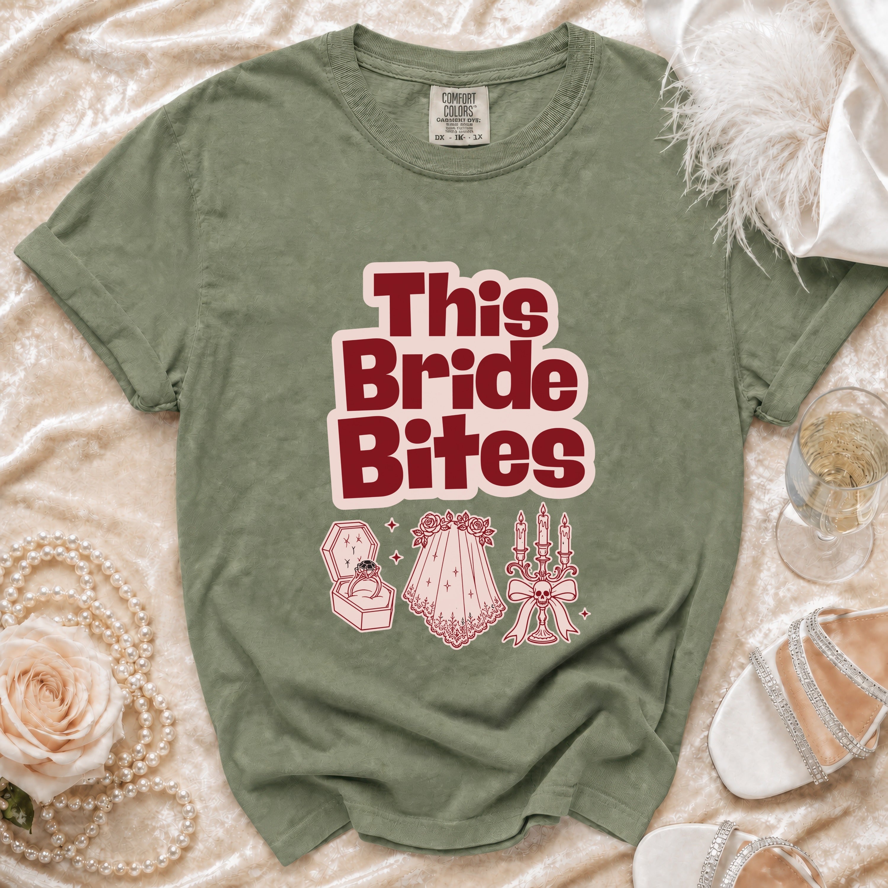 Green t-shirt with "This Bride Bites" text and gothic wedding graphics.