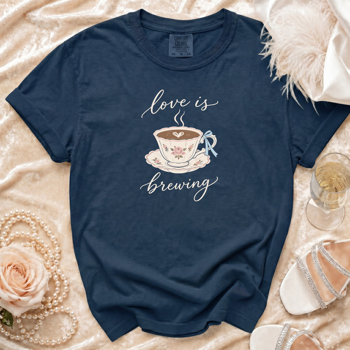 Navy t-shirt with "love is brewing" and a teacup graphic.