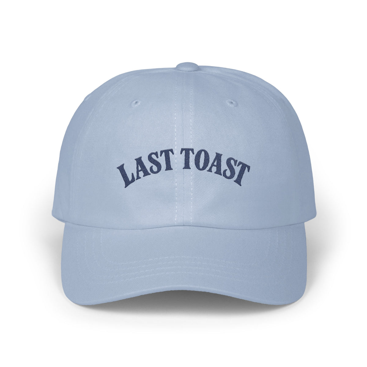 Light blue baseball cap with embroidered navy text "LAST TOAST"