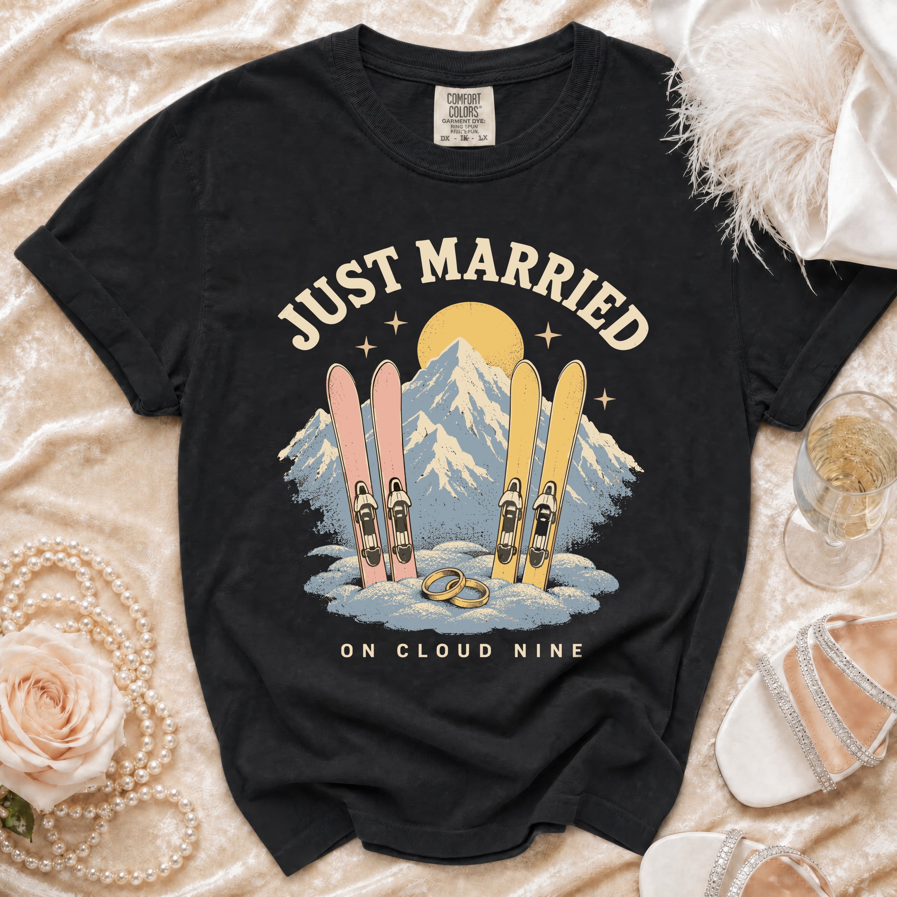 Black t-shirt with "Just Married on Cloud Nine" text, skis, and mountains graphic.
