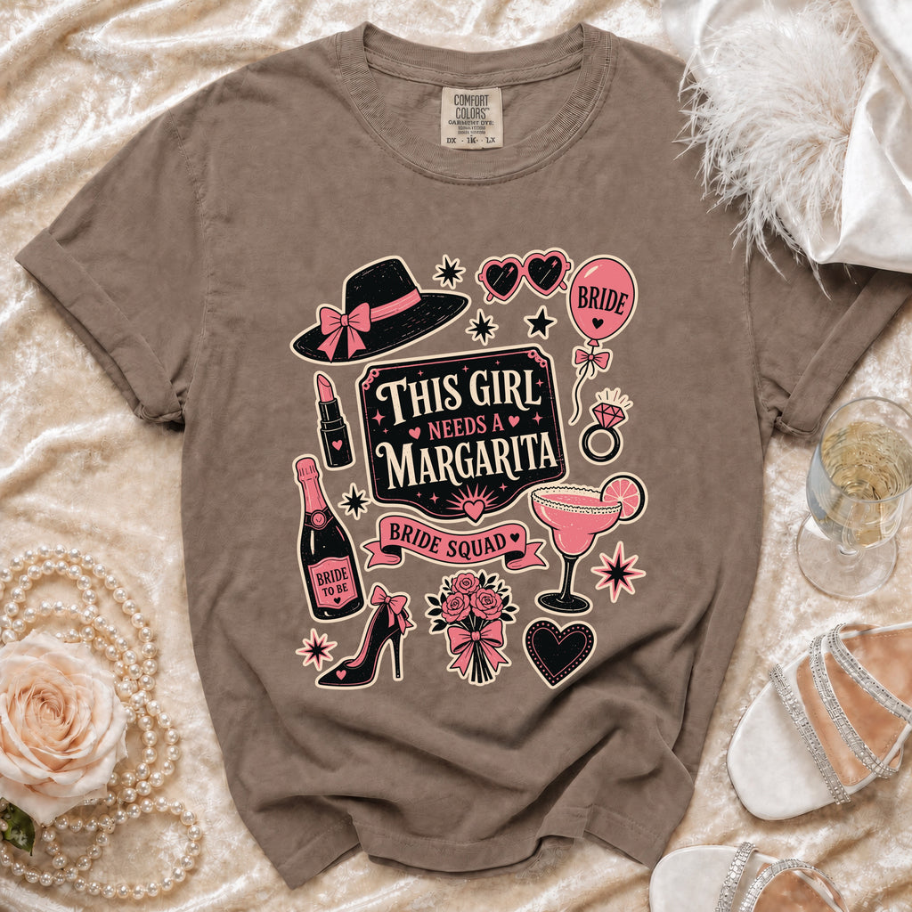 T-shirt with "This Girl Needs a Margarita" graphic, hat, lipstick, and champagne.