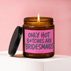 Amber jar candle with pink label reading "ONLY HOT B*TCHES ARE BRIDESMAIDS"