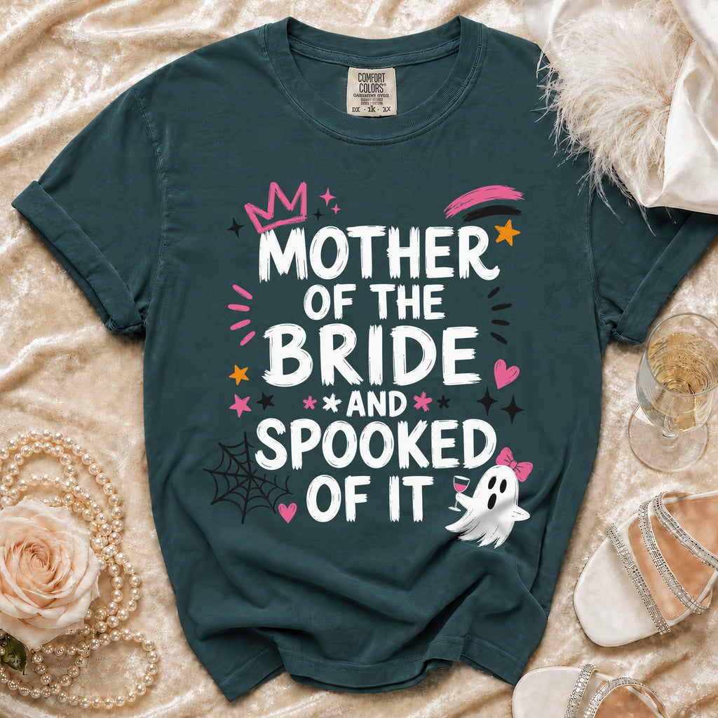 Teal t-shirt with "Mother of the Bride and Spooked of It" Halloween graphic.