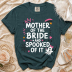 Teal t-shirt with "Mother of the Bride and Spooked of It" Halloween graphic.