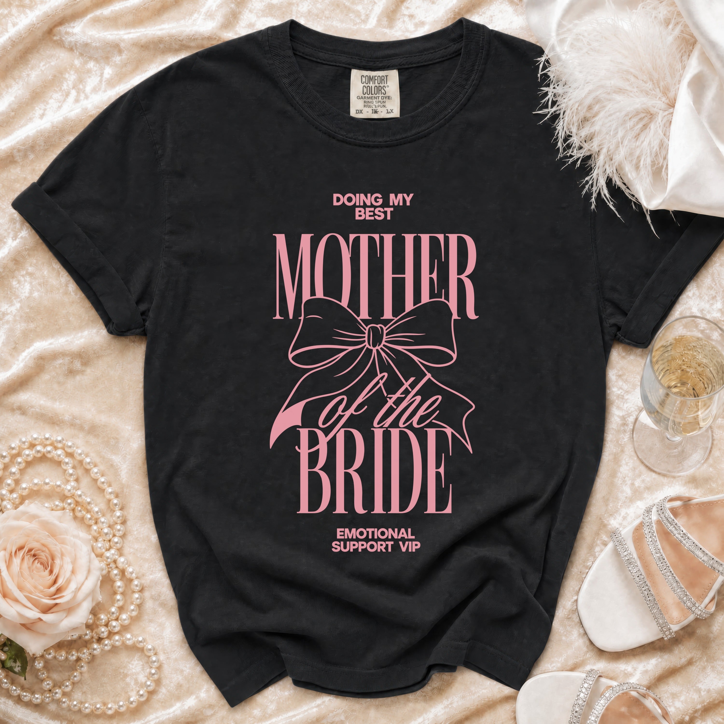 Black t-shirt with pink text that reads "Doing My Best Mother of the Bride Emotional Support VIP".