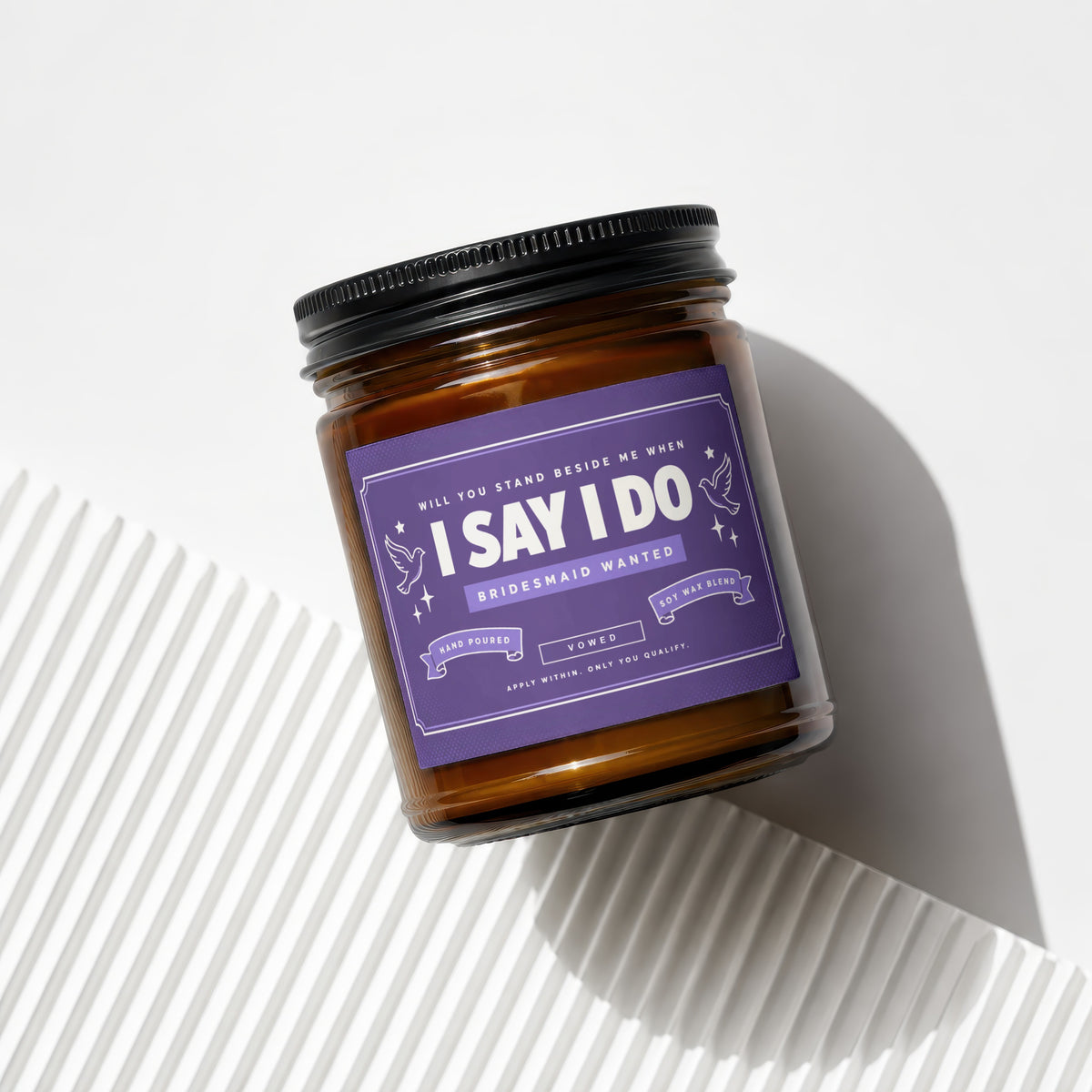 Amber candle with purple label saying "I Say I Do" for bridesmaid.
