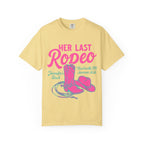 Yellow t-shirt with "Her Last Rodeo" text, cowboy hat, and boots.