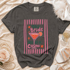 Dark grey Comfort Colors t-shirt with "This Bride Needs a Cosmo" graphic.