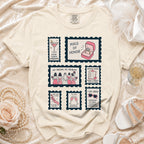 Comfort Colors t-shirt with six illustrated stamps: Maid of Honor, Chief Chaos Coordinator, and more.