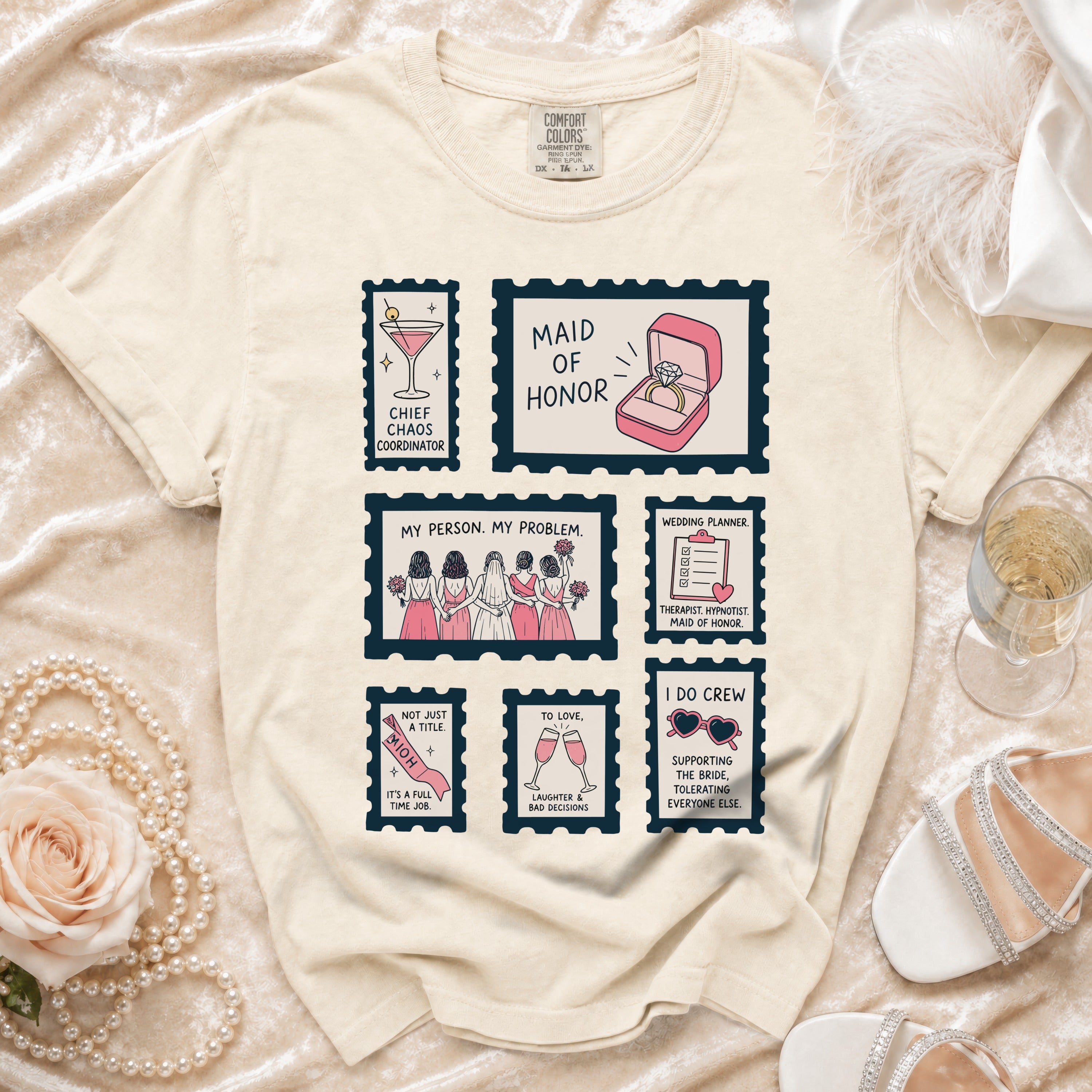 Comfort Colors t-shirt with six illustrated stamps: Maid of Honor, Chief Chaos Coordinator, and more.