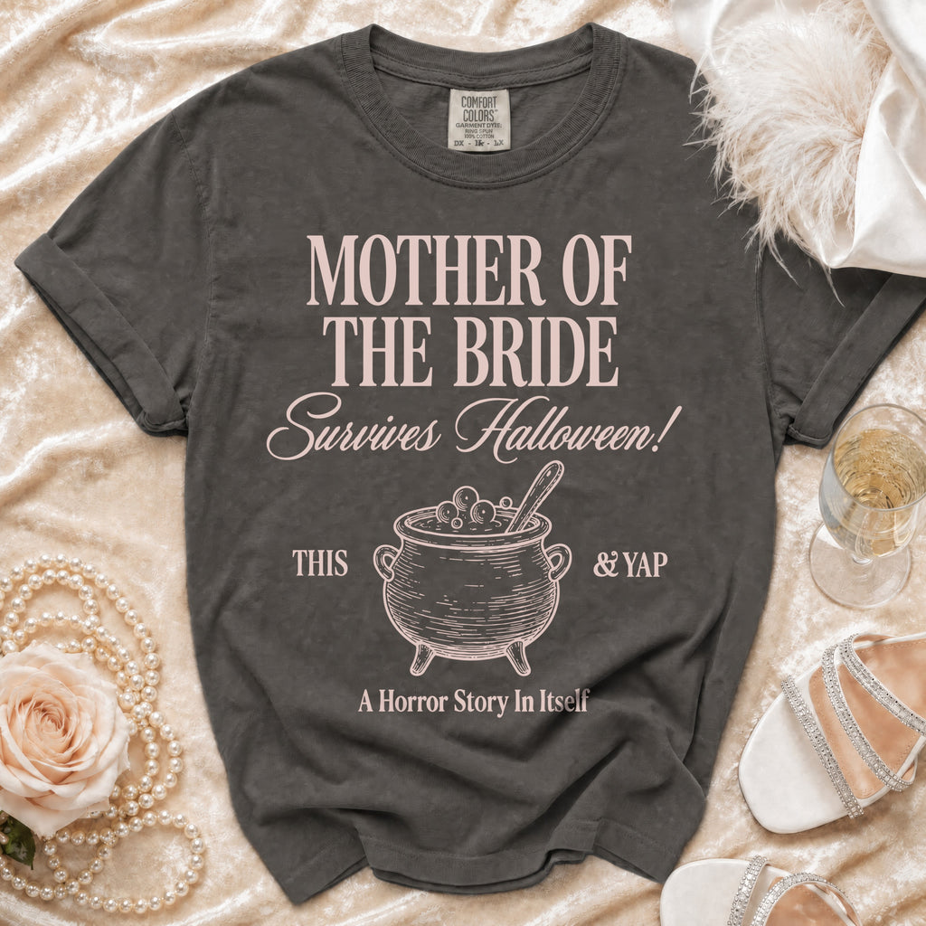 Dark grey t-shirt with "Mother of the Bride Survives Halloween!" text and cauldron graphic.