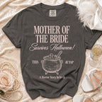 Dark grey t-shirt with "Mother of the Bride Survives Halloween!" text and cauldron graphic.