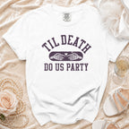 White t-shirt with "Til Death Do Us Party" text and skeleton hands forming a heart.