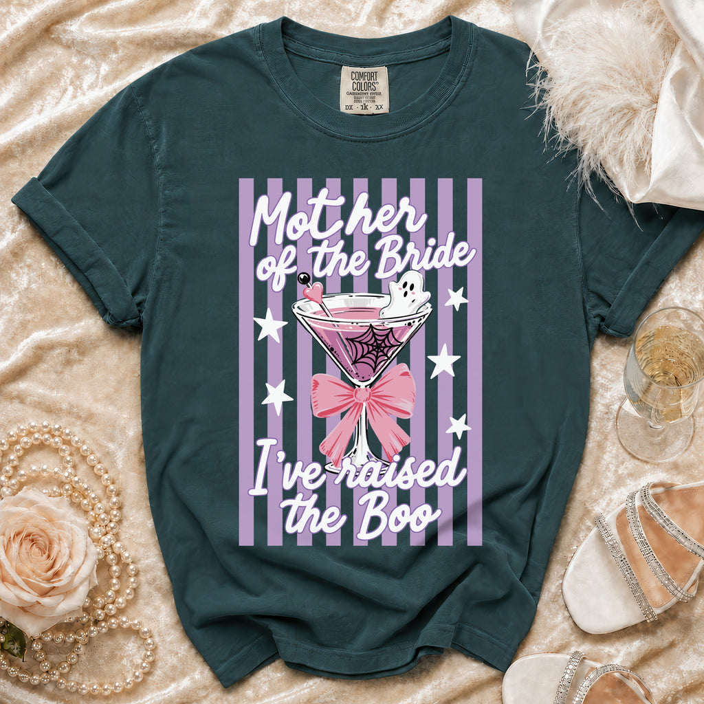"Mother of the Bride I've raised the Boo" graphic on a dark teal t-shirt.