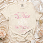 Cream t-shirt with pink graphic "Olivia's Bach Reckless in Texas Austin, TX Summer 2026".