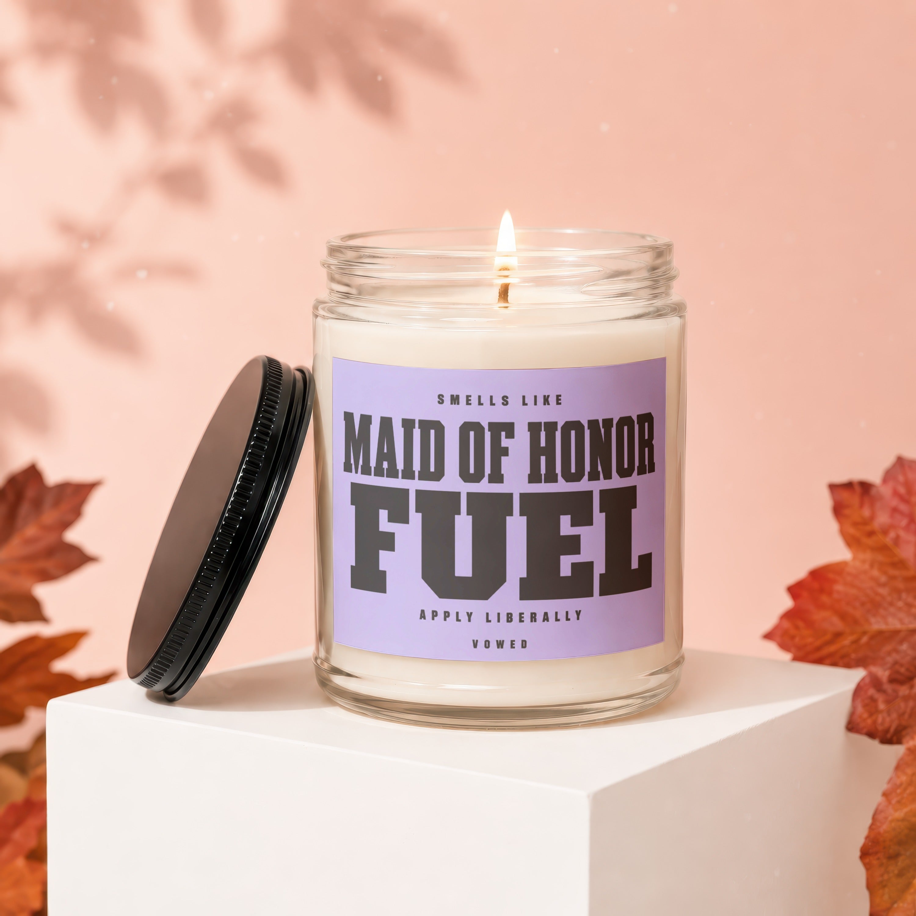 Candle with label "Smells Like Maid of Honor Fuel. Apply Liberally. Vowed."