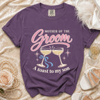 Purple t-shirt with "Mother of the Groom, A toast to my son" graphic.