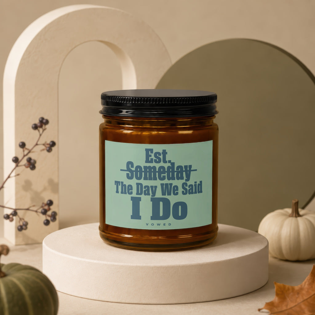 Amber candle with black lid, "Est. Someday The Day We Said I DO VOWED" text.