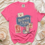 Comfort Colors shirt with "Reckless in Texas" graphic featuring boots and disco ball.