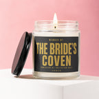Glass candle with text "Member of: The Bride's Coven Admission by Invitation Only Vowed".
