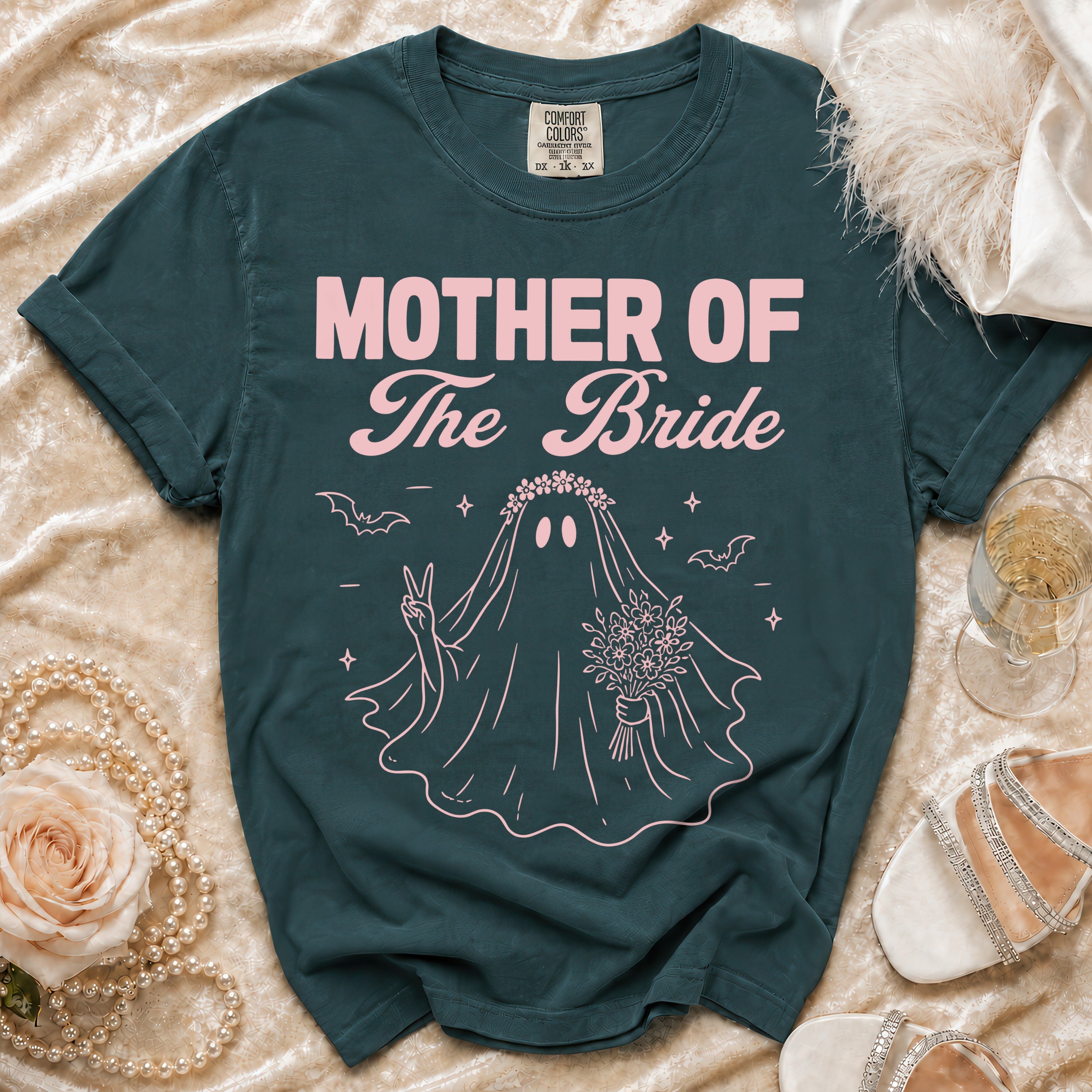 Dark teal t-shirt with pink "Mother of The Bride" text and a ghost bride illustration.