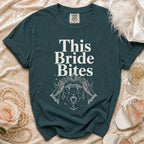 Teal t-shirt with "This Bride Bites" text and vampire lips graphic.
