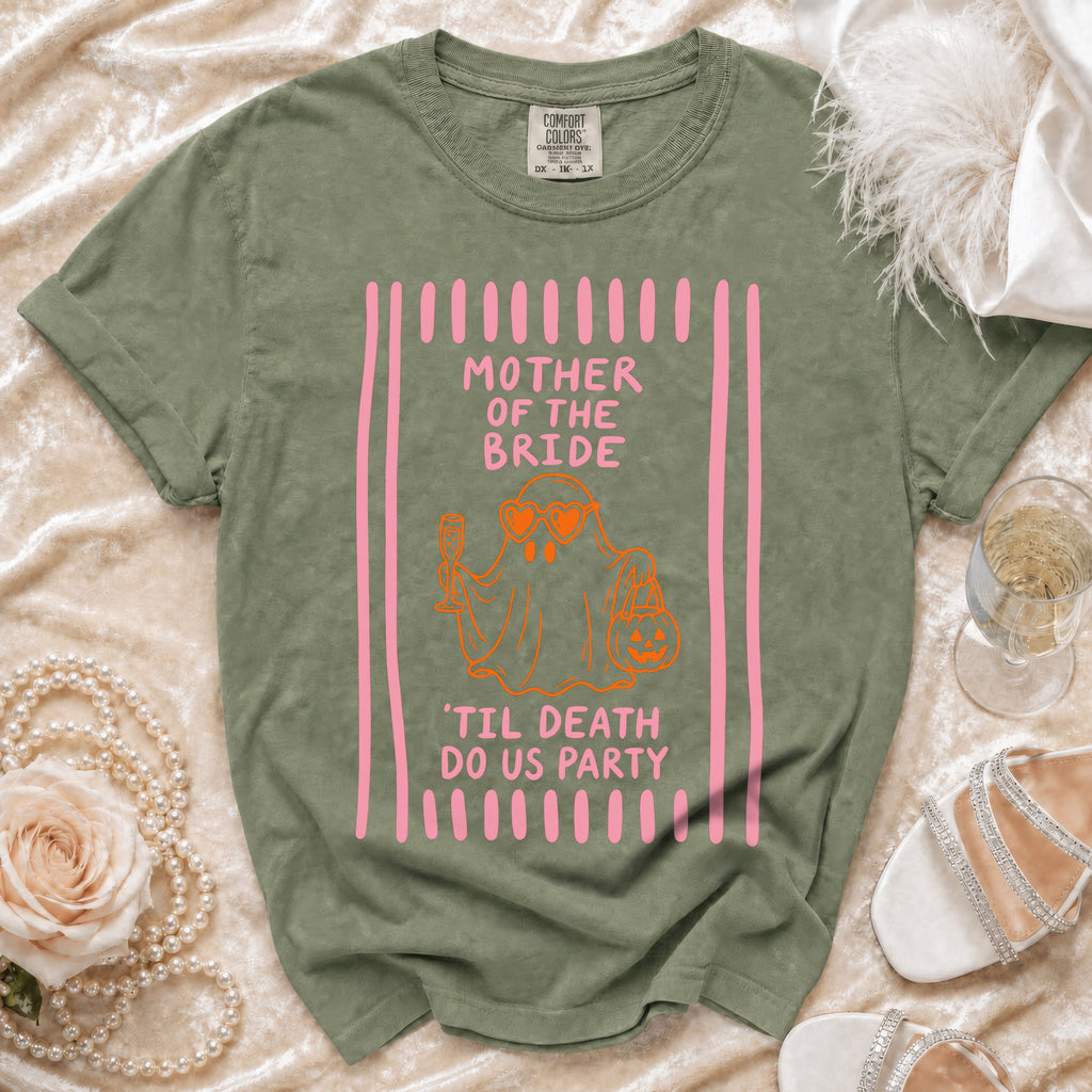 Olive green t-shirt with pink and orange graphic of a ghost holding a drink and pumpkin, and the text Mother of the Bride 'Til Death Do Us Party.