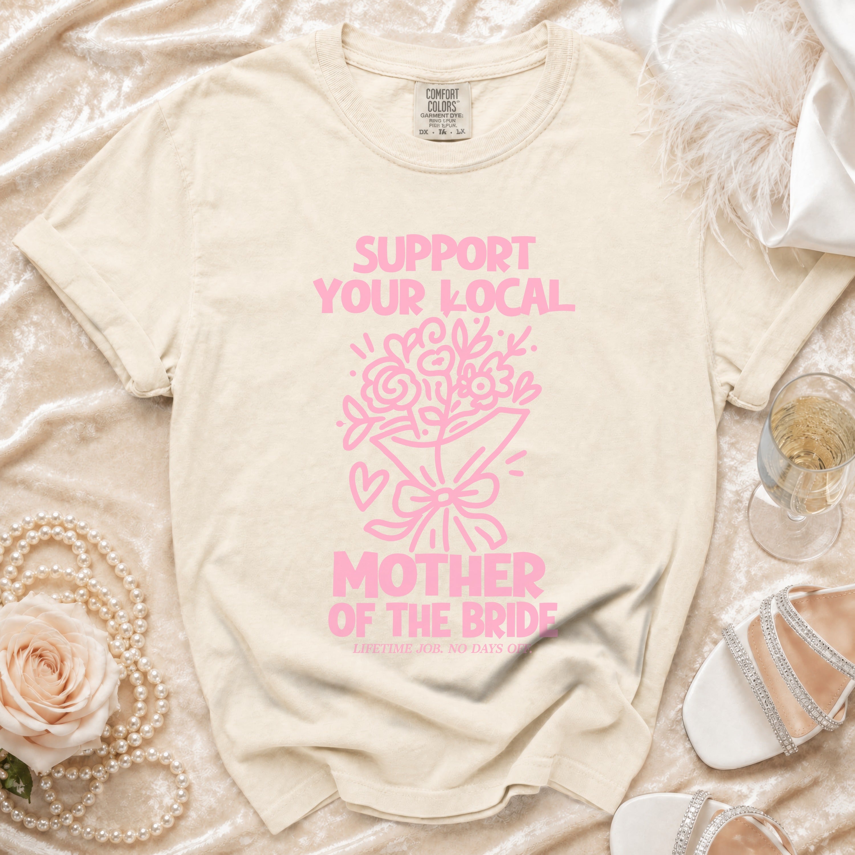 Cream t-shirt with pink graphic: "SUPPORT YOUR LOCAL MOTHER OF THE BRIDE".