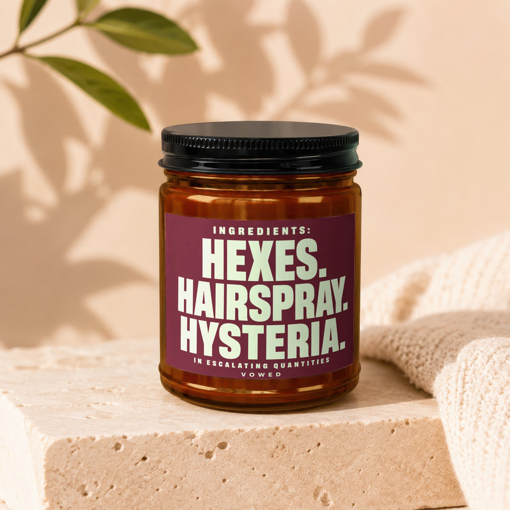 Brown glass jar with label reading "Hexes. Hairspray. Hysteria."
