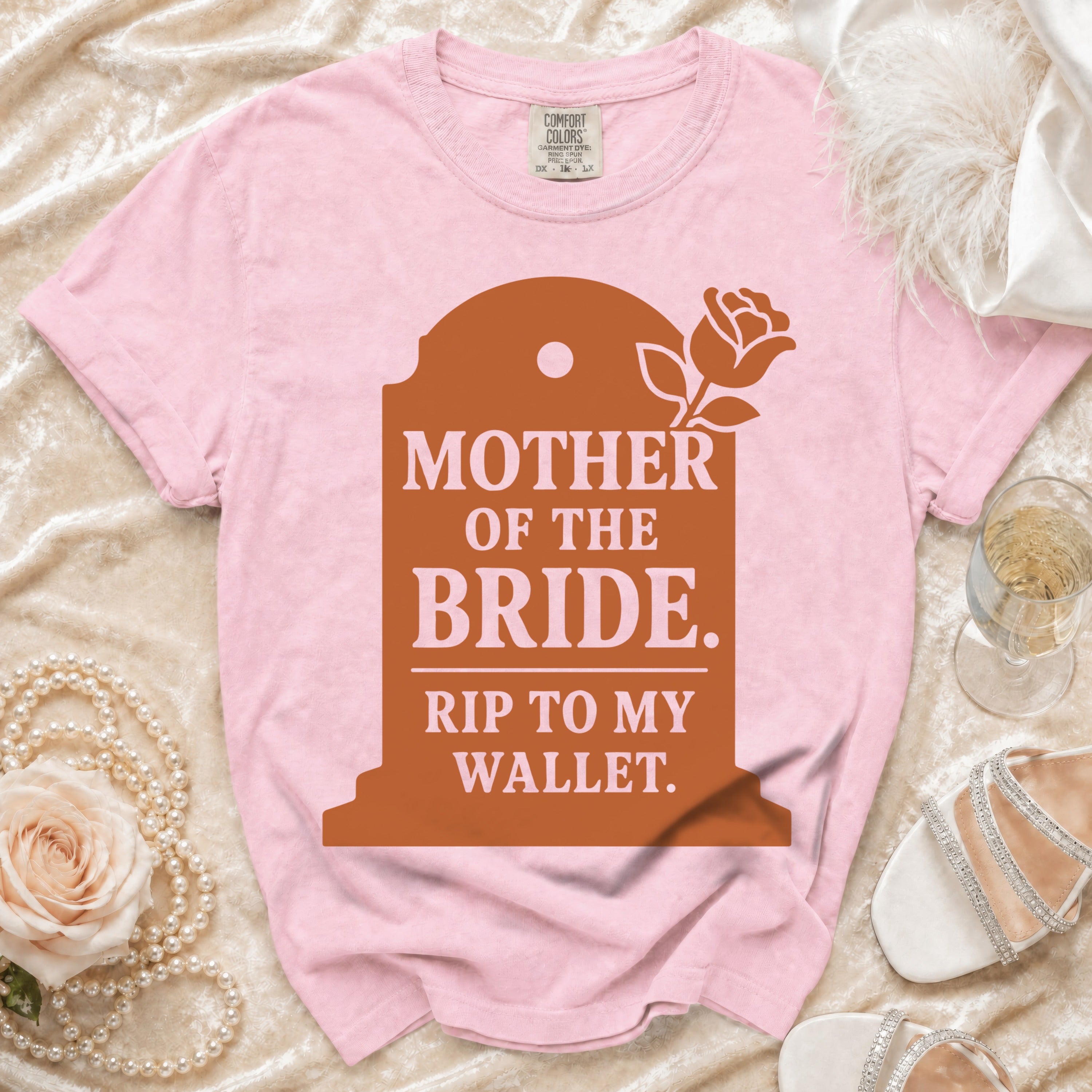 Pink t-shirt with "Mother of the Bride. Rip to My Wallet." graphic.