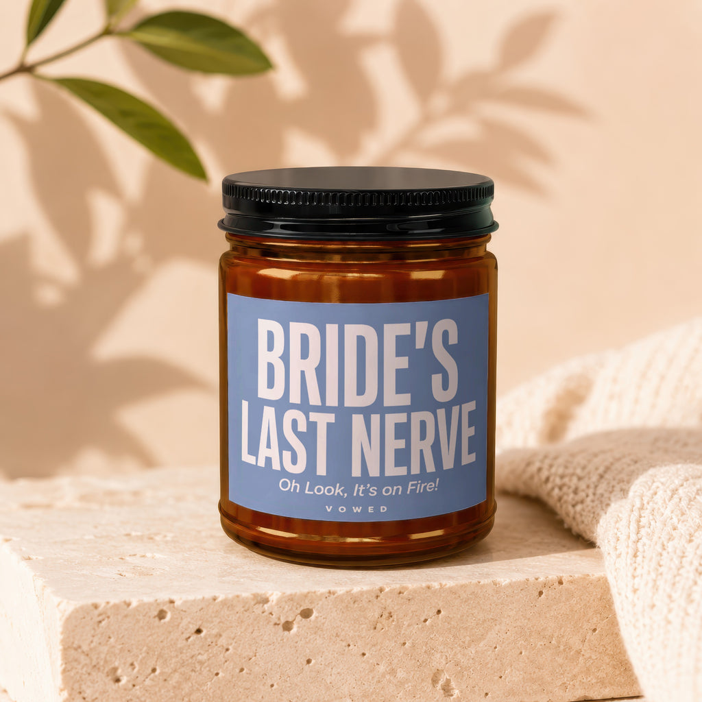 Amber candle in glass jar with black lid, label says "Bride's Last Nerve".