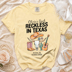 Yellow t-shirt with "Olivia's Bach Reckless in Texas Austin, TX Summer 2026" and graphics.