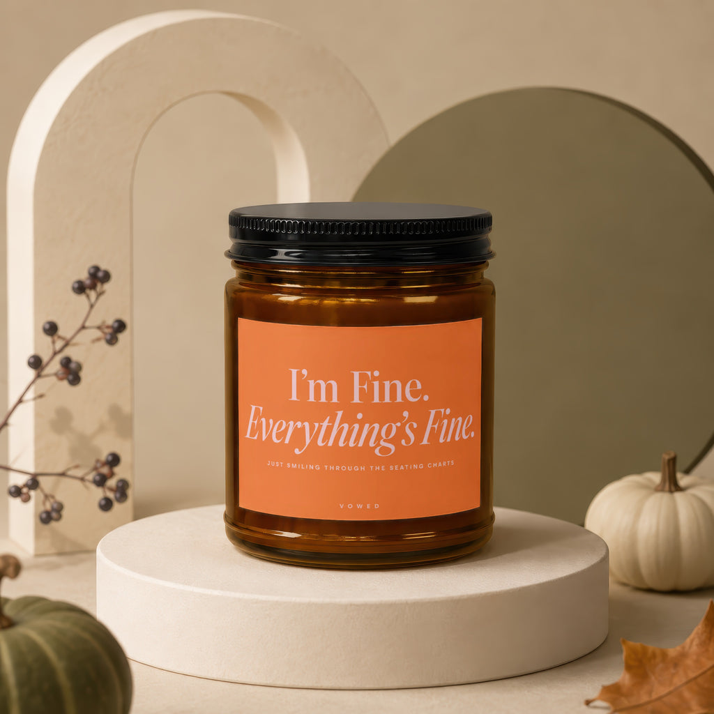 Amber candle with "I'm Fine. Everything's Fine." text on orange label.